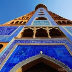 미나레트 오브 잠 유적지 - **Prompt:** A majestic, vertical wide-shot of the Minaret of Jam in its prime, circa 1200 AD. The mi...